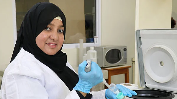 Dr. Khamis doing her research in the laboratory