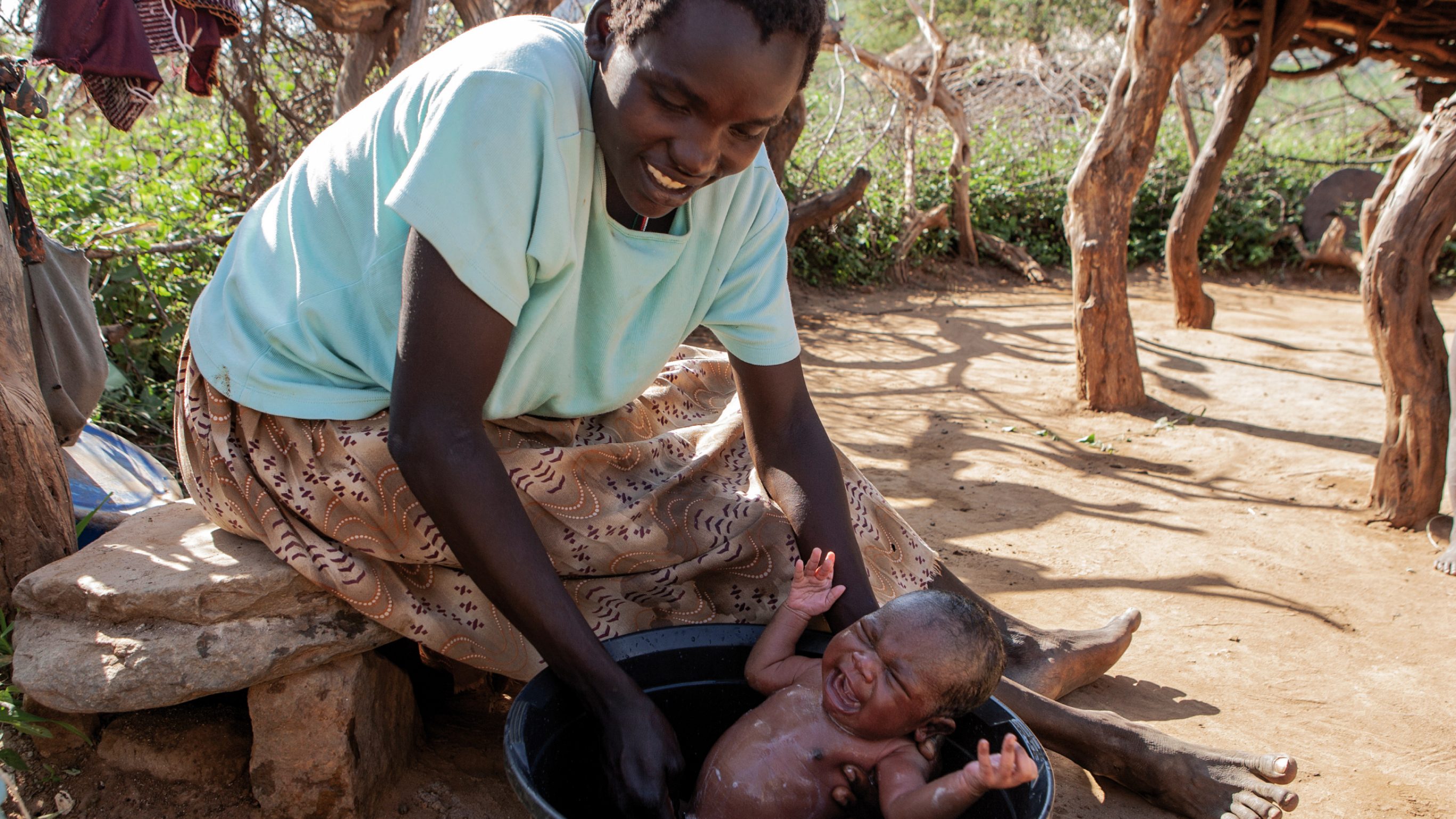 2006: Chemunung Lopus baths her three-day-old son named Kibet